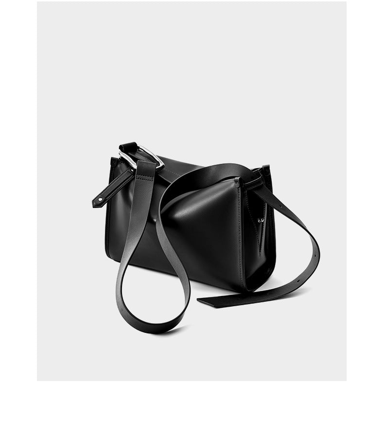 Black pillow bag back angle showing strap and hardware