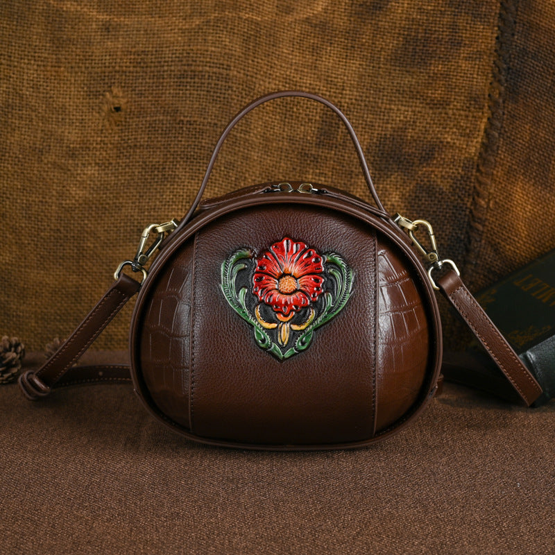Vintage coffee round leather bag front view with embossed side panels