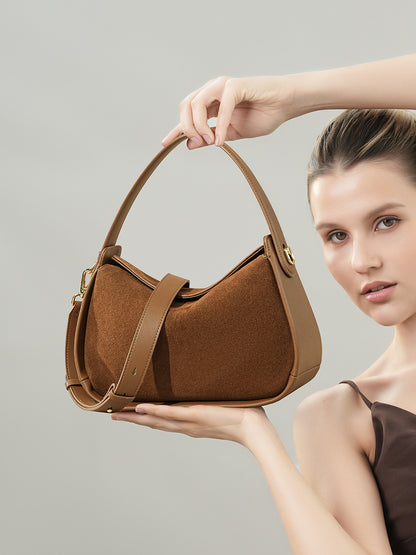 Brown brushed leather shoulder bag shown with its long strap