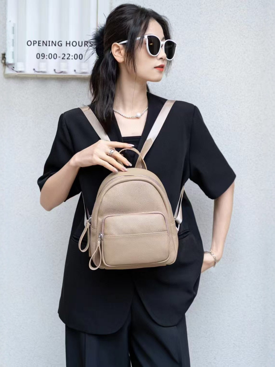 Ivory leather backpack front view with front pocket