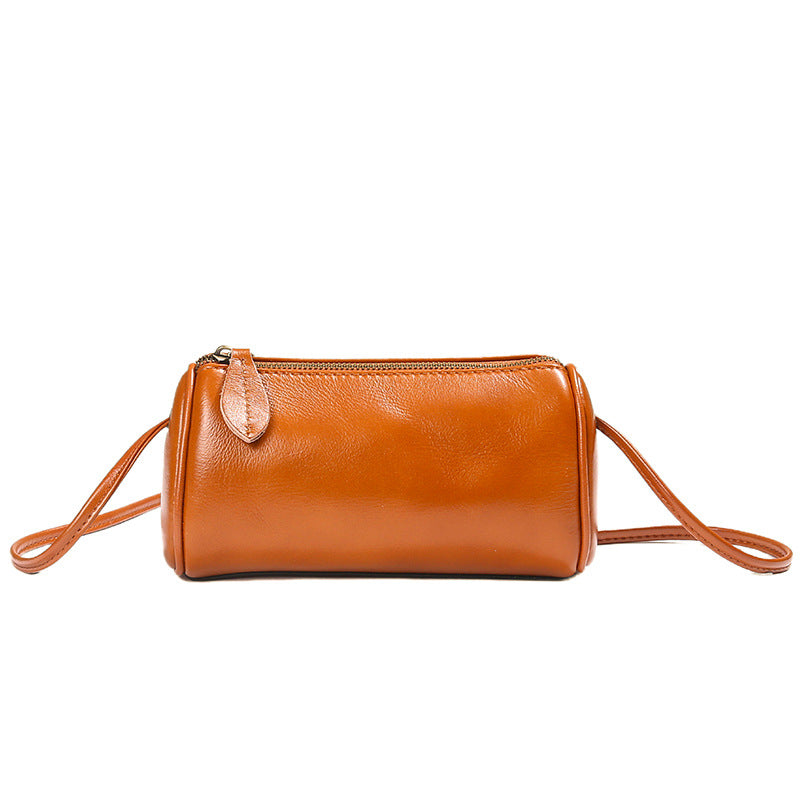 Sunset yellow leather barrel crossbody bag with adjustable strap