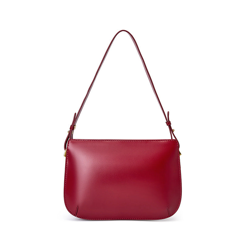 Burgundy cowhide leather underarm bag shown from the front on a white background