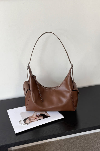 Brown leather shoulder bag with relaxed rectangular silhouette