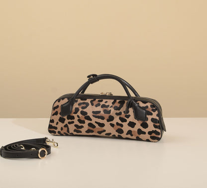 Front view of leopard-print bag with its removable strap