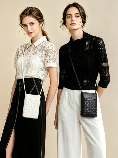 Two models wearing black and cream white woven phone bags styled with casual outfits