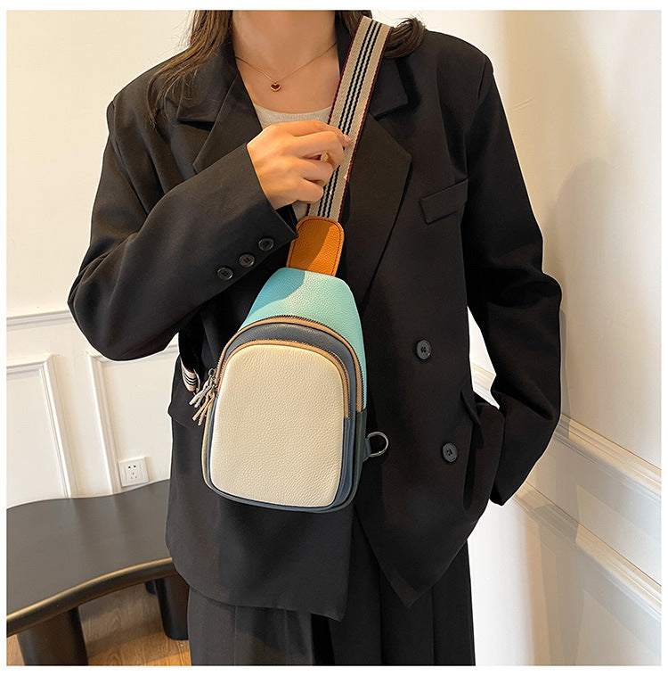 Striped strap and colorblock cowhide bag worn crossbody