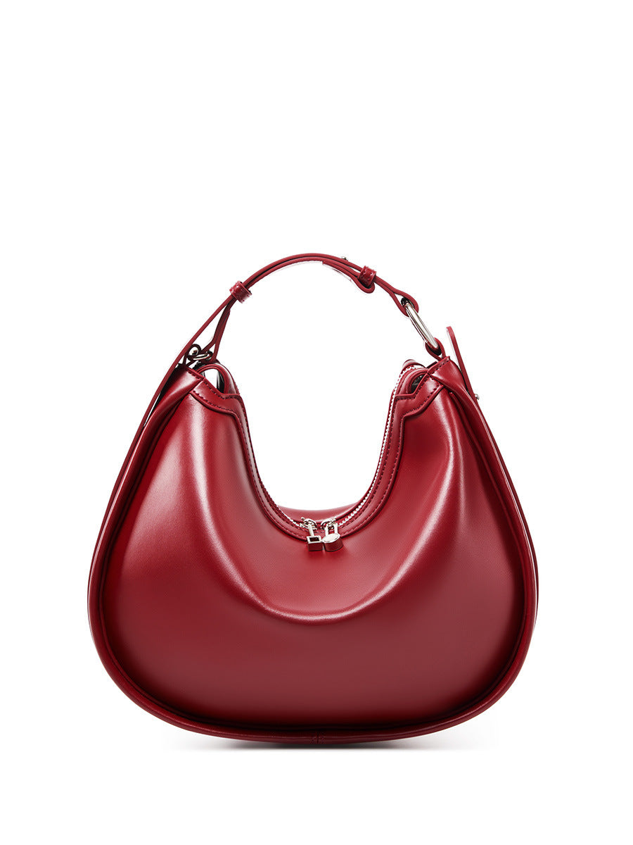 Burgundy cowhide leather crescent bag front view with silver hardware