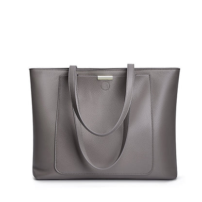 Front view of dark gray pebbled leather tote bag with dual straps on white background