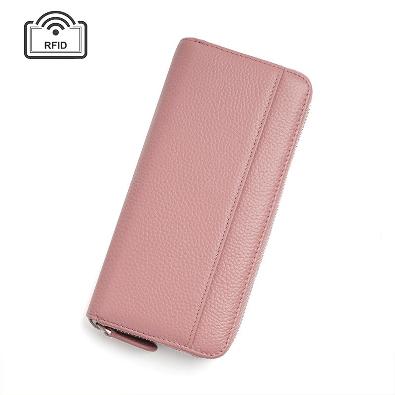 Light pink leather wallet with stitching on white background