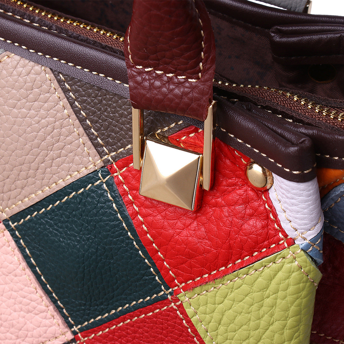 Close-up of diamond patchwork stitching and gold-color bag hardware