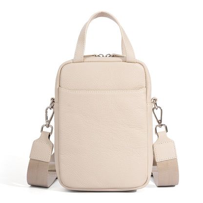 Off white pebbled leather mini crossbody phone bag with silver-tone hardware and woven shoulder strap