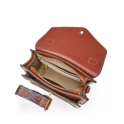 Interior view of brown leather messenger bag showing zip pocket, card slots, and slip pockets