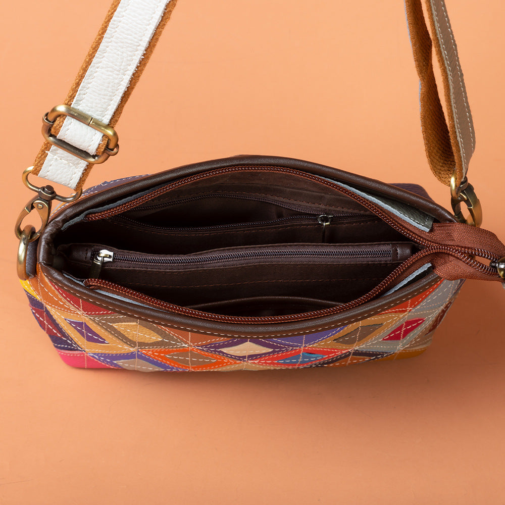 Open bag showing polyester lining and interior zip and slip pockets