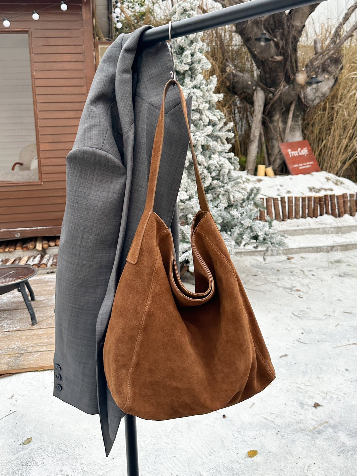 Taupe shoulder tote showing its soft bucket silhouette