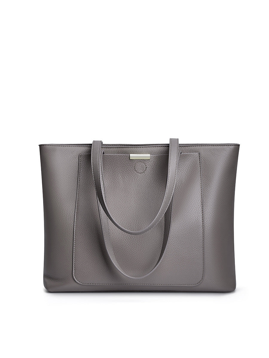Dark gray pebbled leather tote displayed flat against a white background