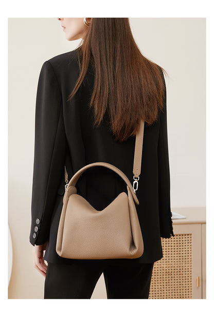 Back view of model wearing pebbled leather crossbody bag