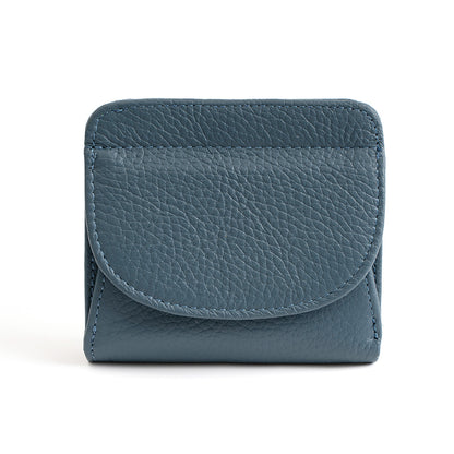 Blue leather wallet with pebbled texture on white background