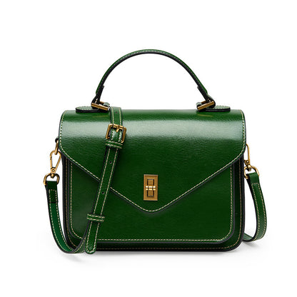 Green cowhide leather small messenger bag with structured flap closure
