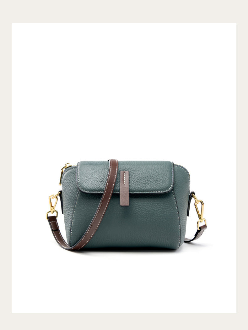 Front studio view of the sea blue shell crossbody bag