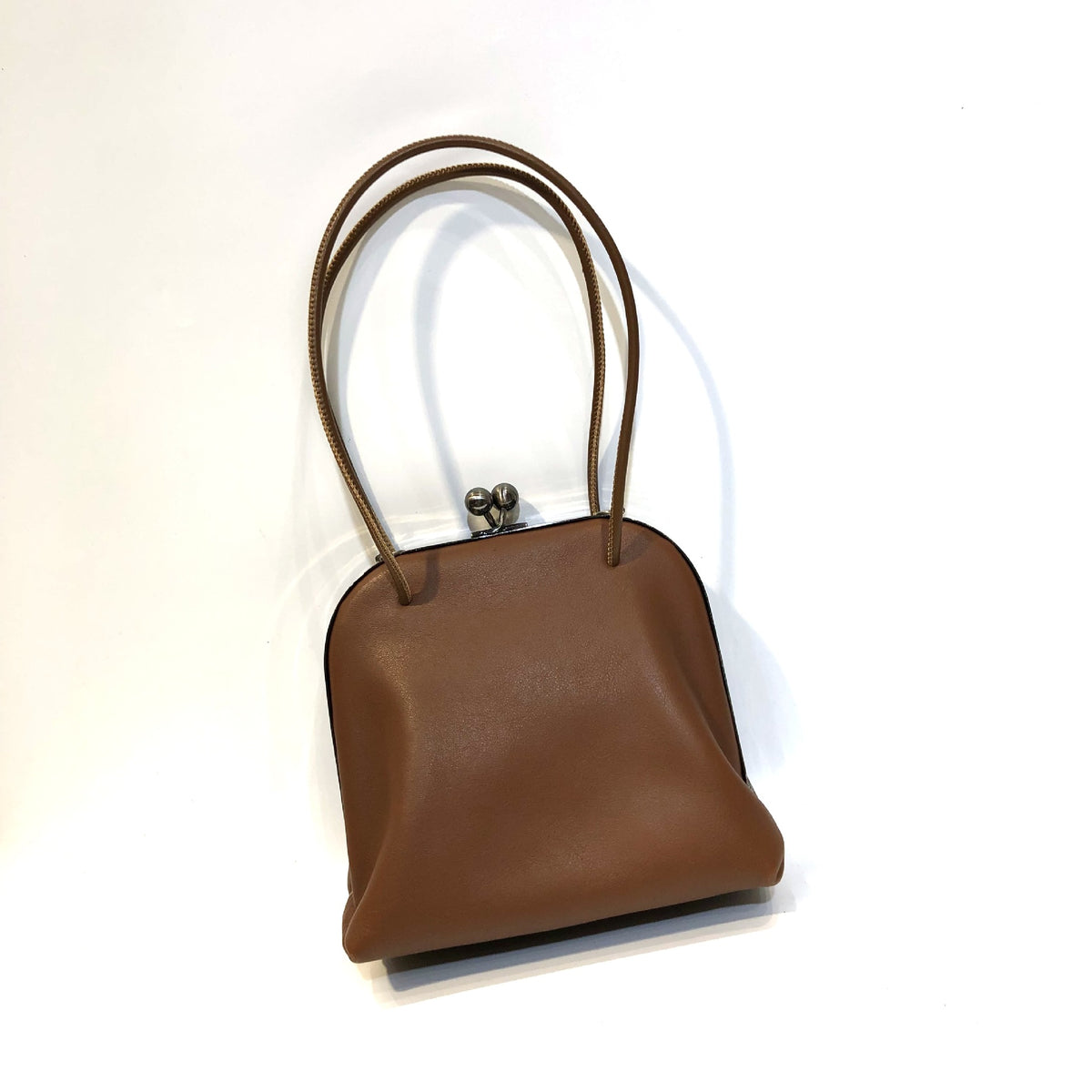 Coffee leather bag with long shoulder straps and frame clasp