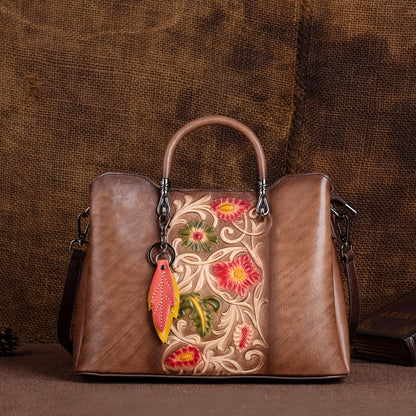 Coffee-colored embossed floral handbag with shoulder strap