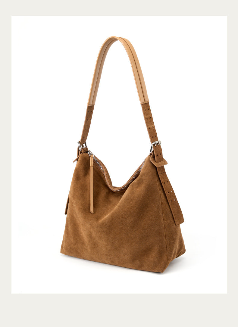 Three-quarter view highlighting the tote's soft silhouette