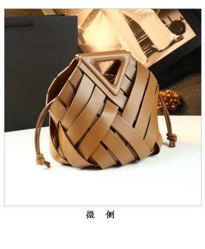 Brown woven bucket bag viewed at a slight angle