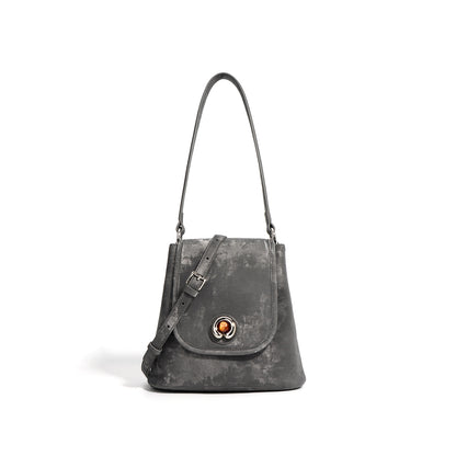 Pewter gray split leather bucket bag with magnetic flap front view