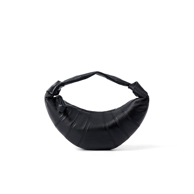 Black lambskin crescent crossbody bag front view on white background