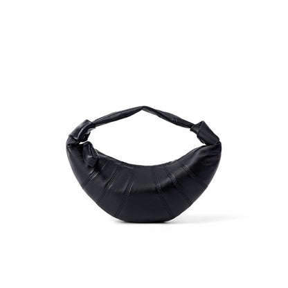 Black lambskin crescent crossbody bag front view on white background
