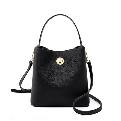 Black top-grain cowhide bucket bag with turn-lock closure front view