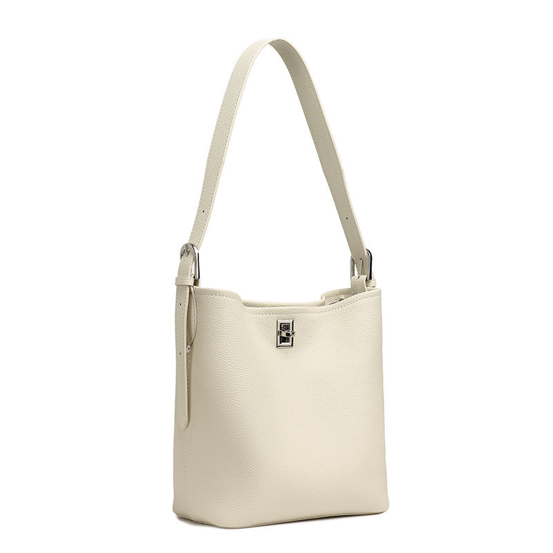 Off-white top-grain cowhide leather bucket bag on white background