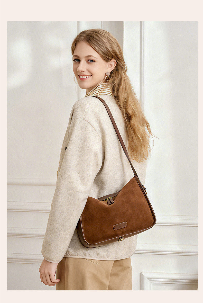 Coffee-colored pillow-shaped crossbody bag viewed from the back