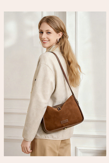 Coffee-colored pillow-shaped crossbody bag viewed from the back