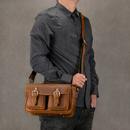 Model wearing a brown leather camera crossbody bag