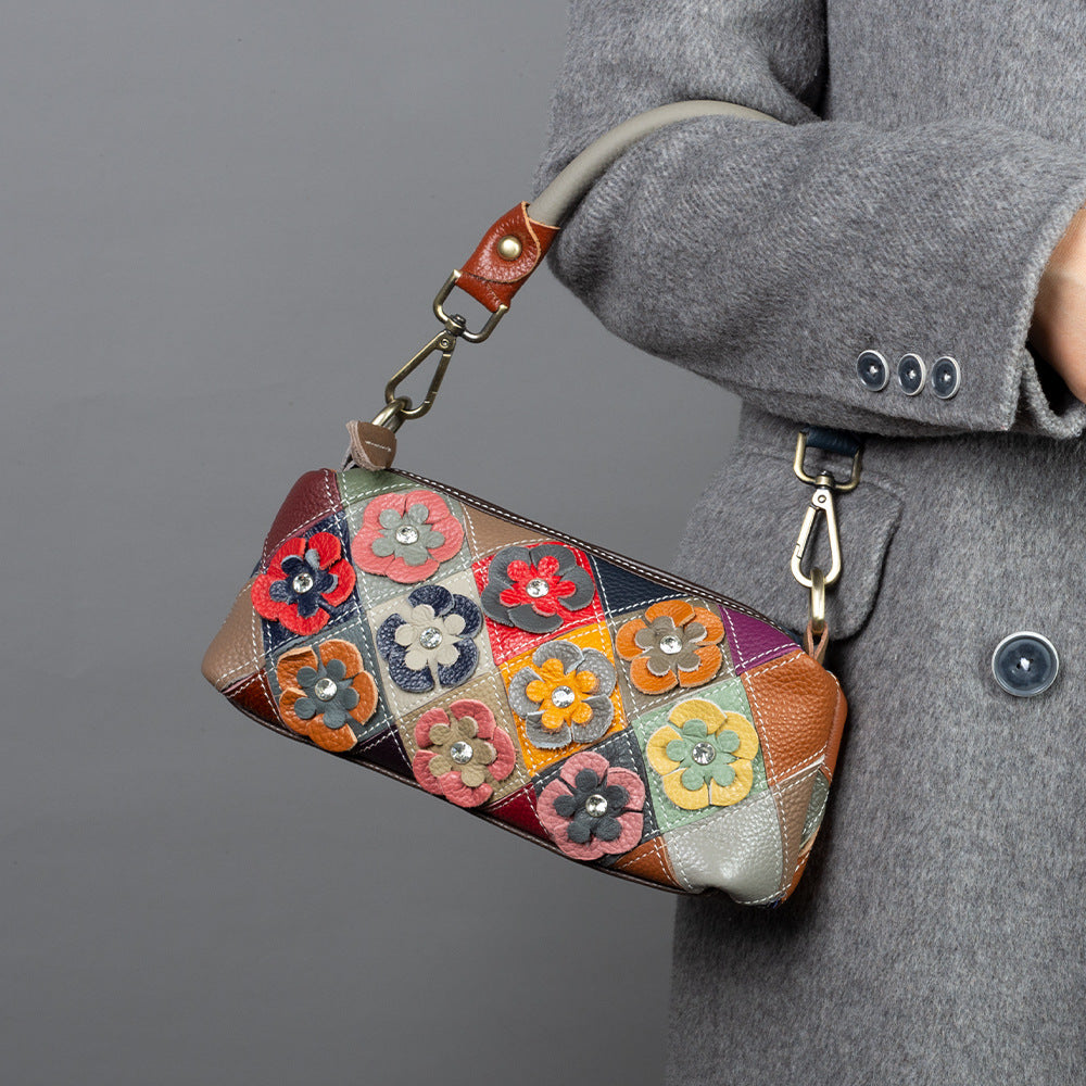 Flower patchwork bag shown worn over the shoulder
