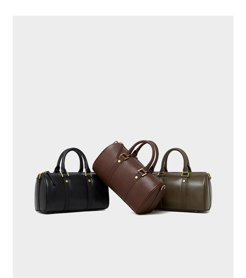 Three Boston bags in black, dark brown, and olive green on white background