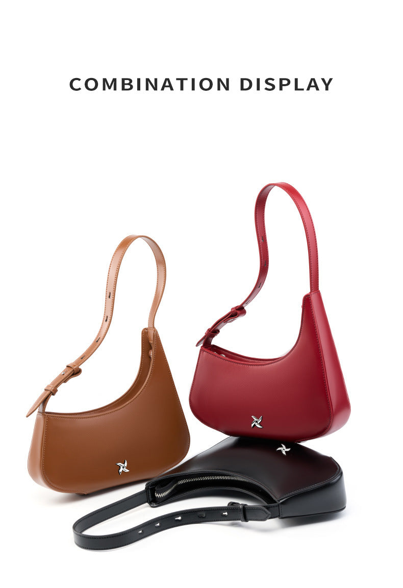 Set of three crescent shoulder bags in brown, red, and black
