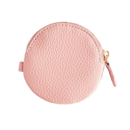 Pink cowhide leather round coin purse with gold zipper on white background