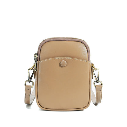 Apricot cowhide leather mini crossbody bag with adjustable strap, front view