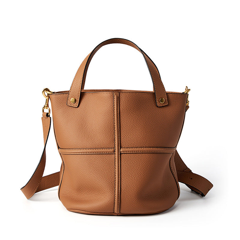 Brown top-grain cowhide bucket bag on white background