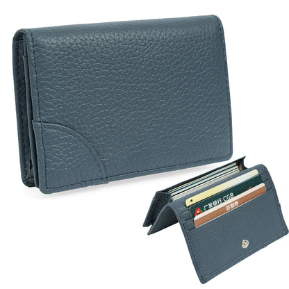 Dark blue pebbled cowhide leather card holder showing tiered card slots open