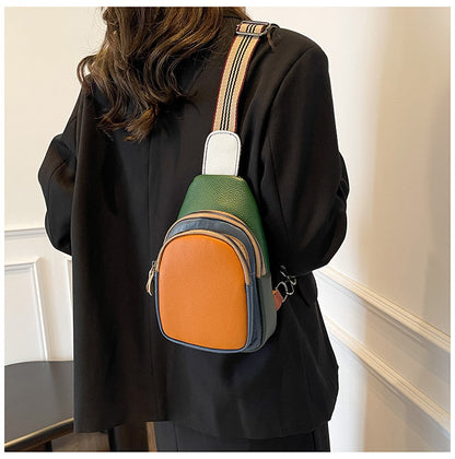 Orange-front colorblock sling bag with green panels