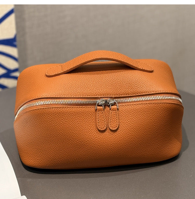 Golden brown leather makeup pouch with double zipper pulls