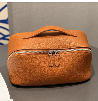 Golden brown leather makeup pouch with double zipper pulls