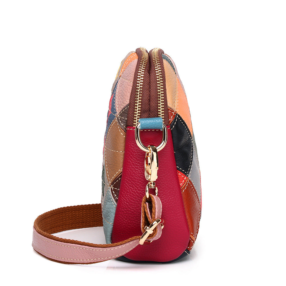 Side profile showing the bag depth, zipper, and shoulder strap