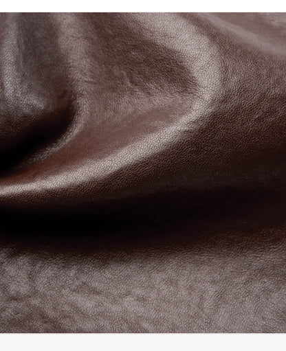 Close-up of brown cowhide leather texture and grain