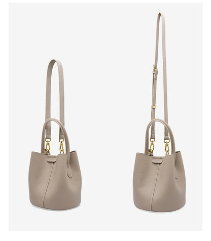 Two side views of bucket bag demonstrating short and long strap length