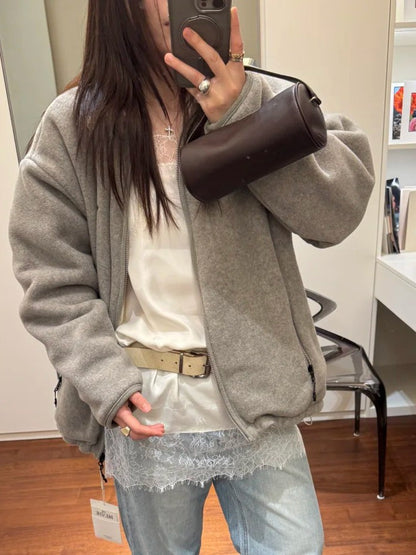 Dark brown cylinder shoulder bag styled with a casual outfit
