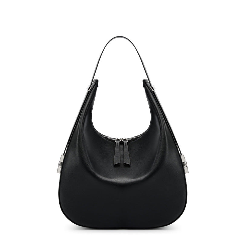Black cowhide leather crescent hobo shoulder bag front view on white background, top zip and adjustable strap visible